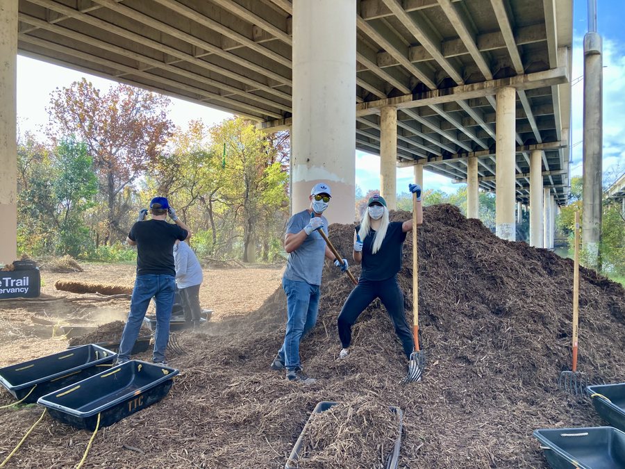 Restore team members volunteering on a trail conservancy clean-up