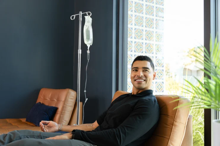 Client relaxing during IV Drip Therapy