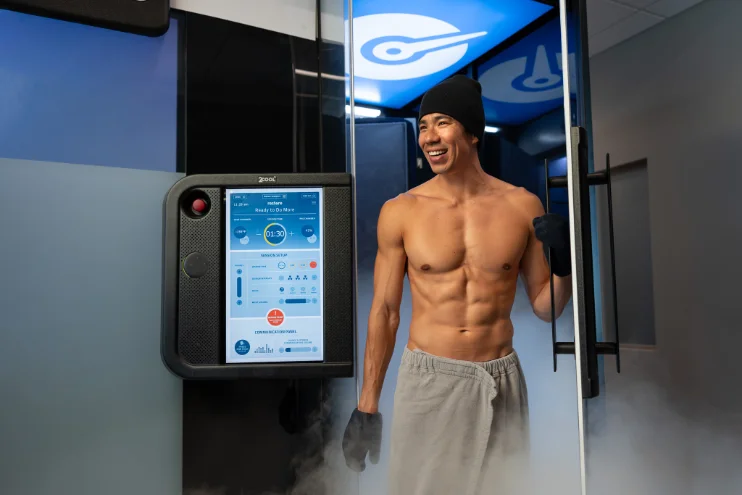 Client stepping out of a Cryotherapy chamber