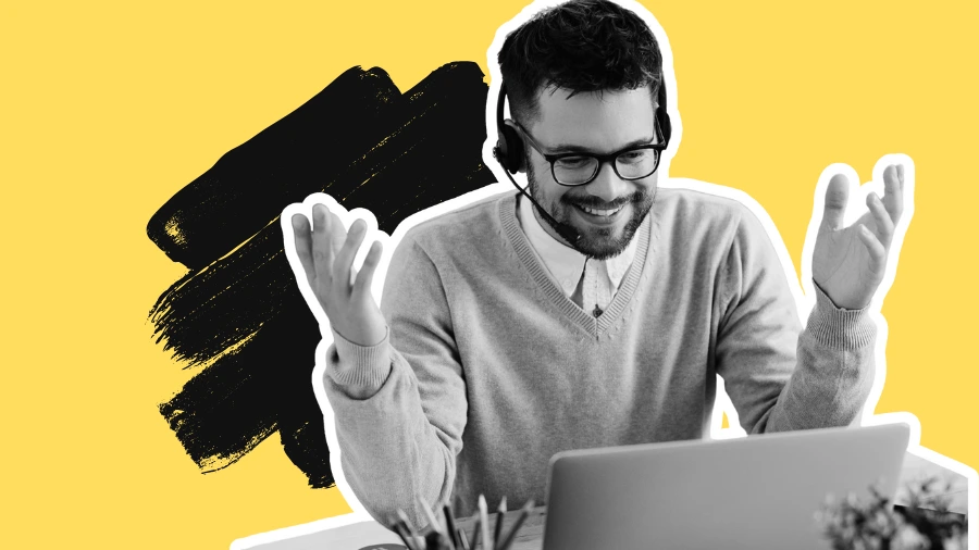 Smiling man wearing a headset gestures while on a video call using a laptop, with a bold yellow and black graphic background.