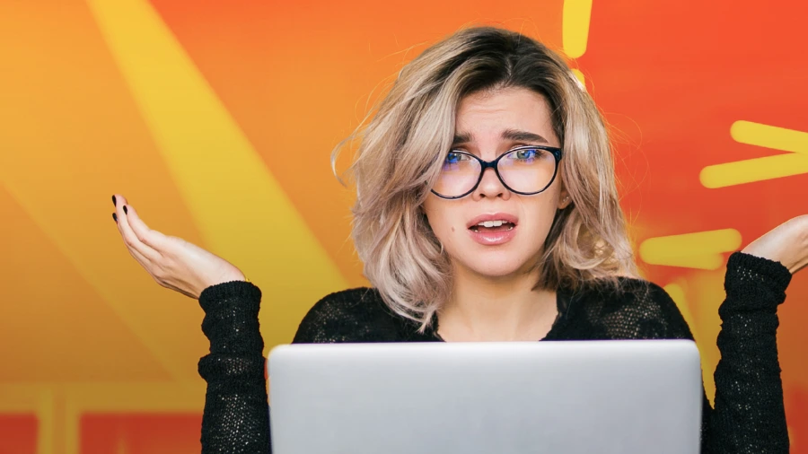 Confused marketer looking at a laptop, representing why generic marketing strategies fail to convert