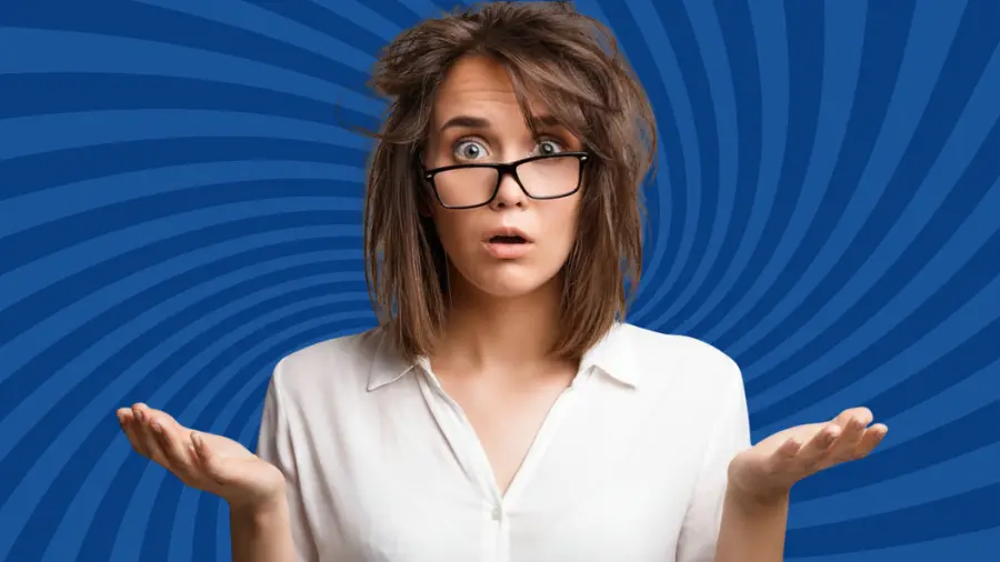 Confused woman with messy hair and glasses shrugging against a blue abstract background, symbolizing uncertainty, mixed signals, and decision-making confusion.