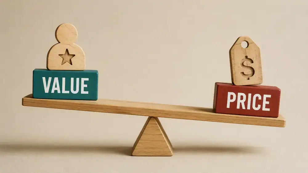 Wooden balance scale comparing value and price, with the value side outweighing the price side, symbolizing the difference between communicating benefits and justifying cost.