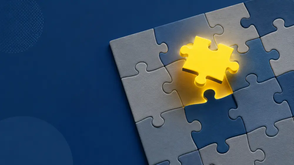 Nearly completed jigsaw puzzle with one glowing yellow piece hovering over the missing spot, symbolizing the missing element needed to create client loyalty.