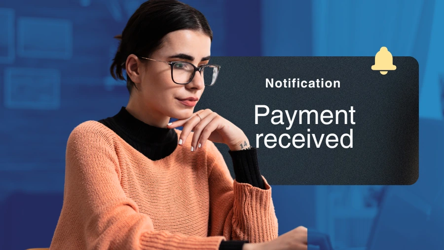 Freelancer managing automatic recurring client payments on a laptop