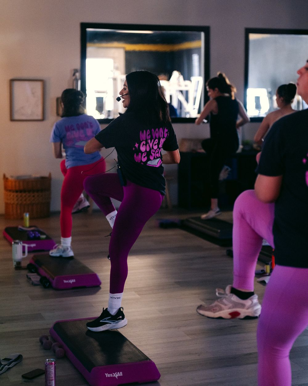 Group fitness class on the step floor at Facet Seven