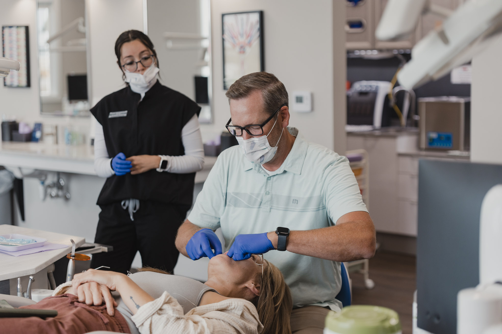 Person holding upper and lower invisalign. 