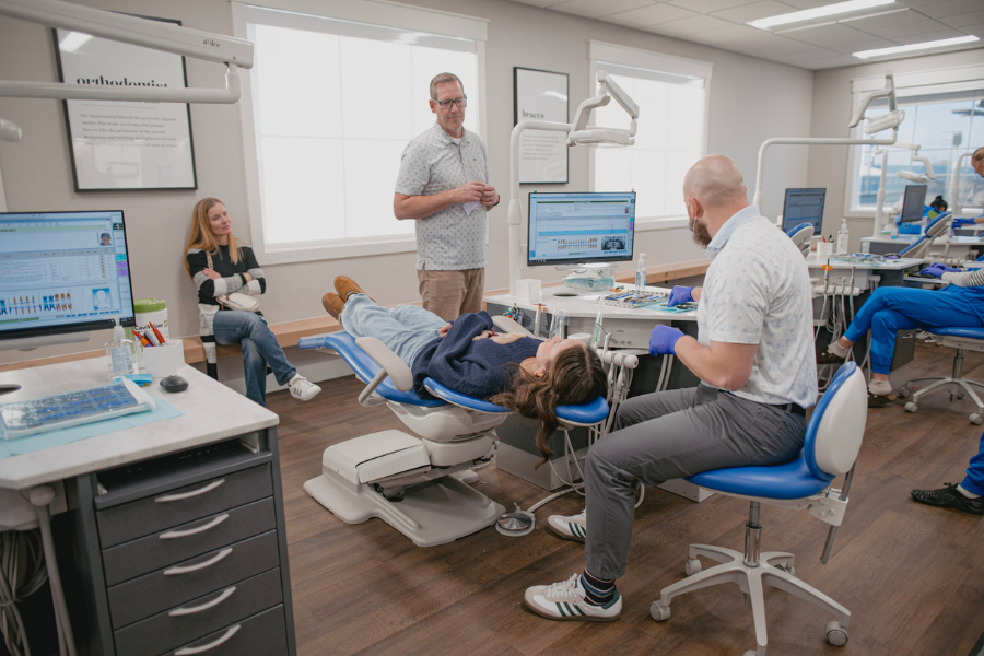 Orthodontist consulting with patient during treatment visit in a bright, modern Idaho Orthodontics clinic