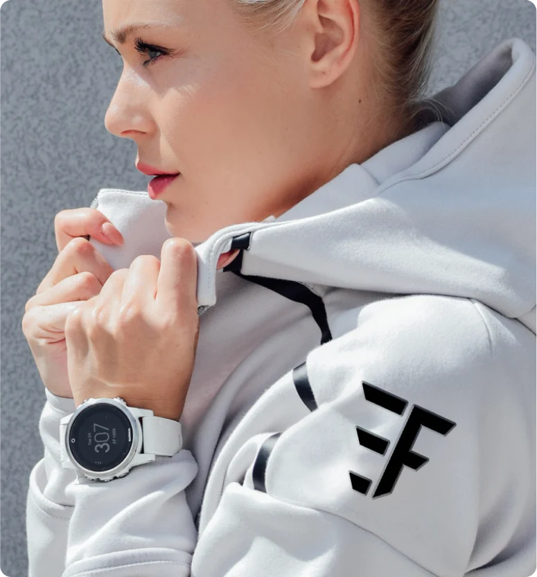 A woman wearing an Elite Fitness  branded hoodie