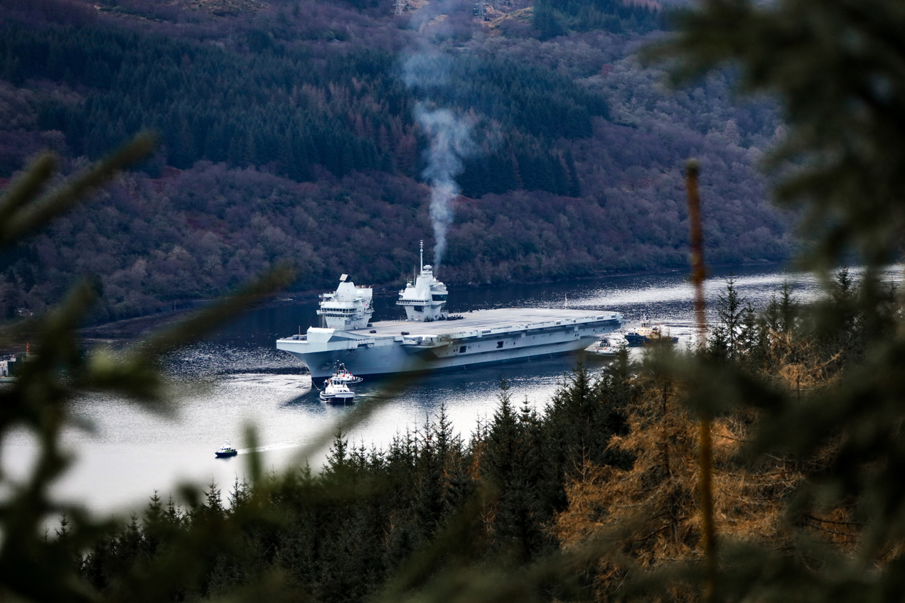 The Queen Elizabeth Class Carrier sailing through a gorge