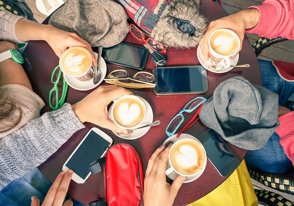 Coffee and phones on the table