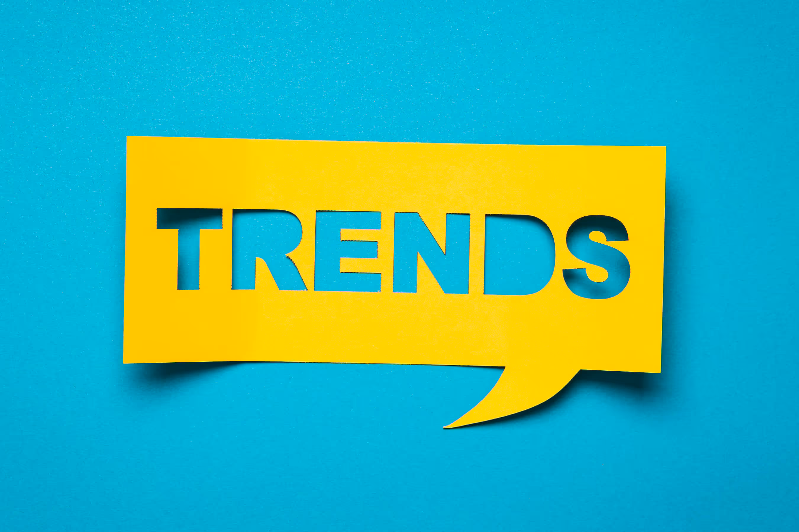 Picture showing the word trends as a paper cutout 