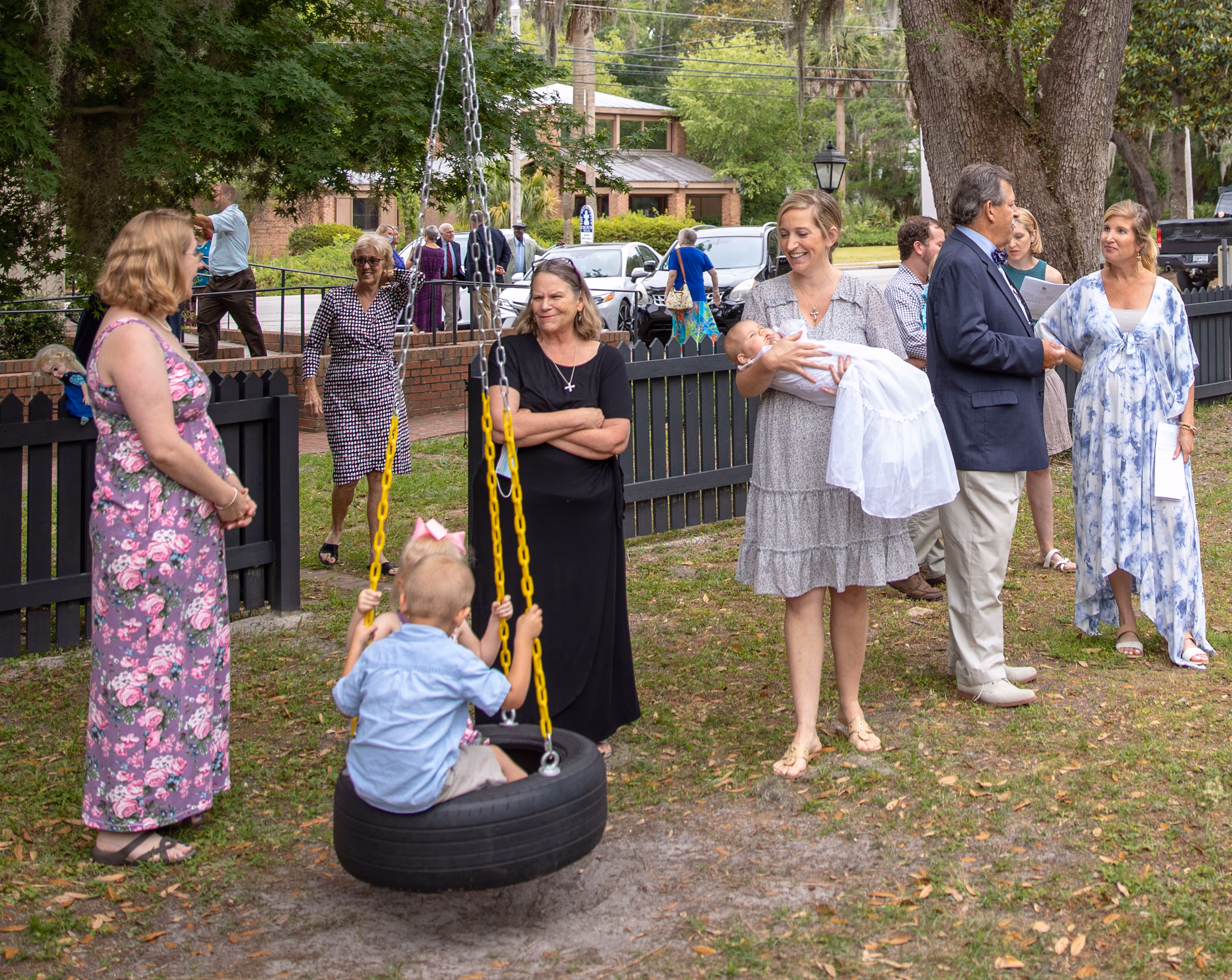 Mothers outside with children playing