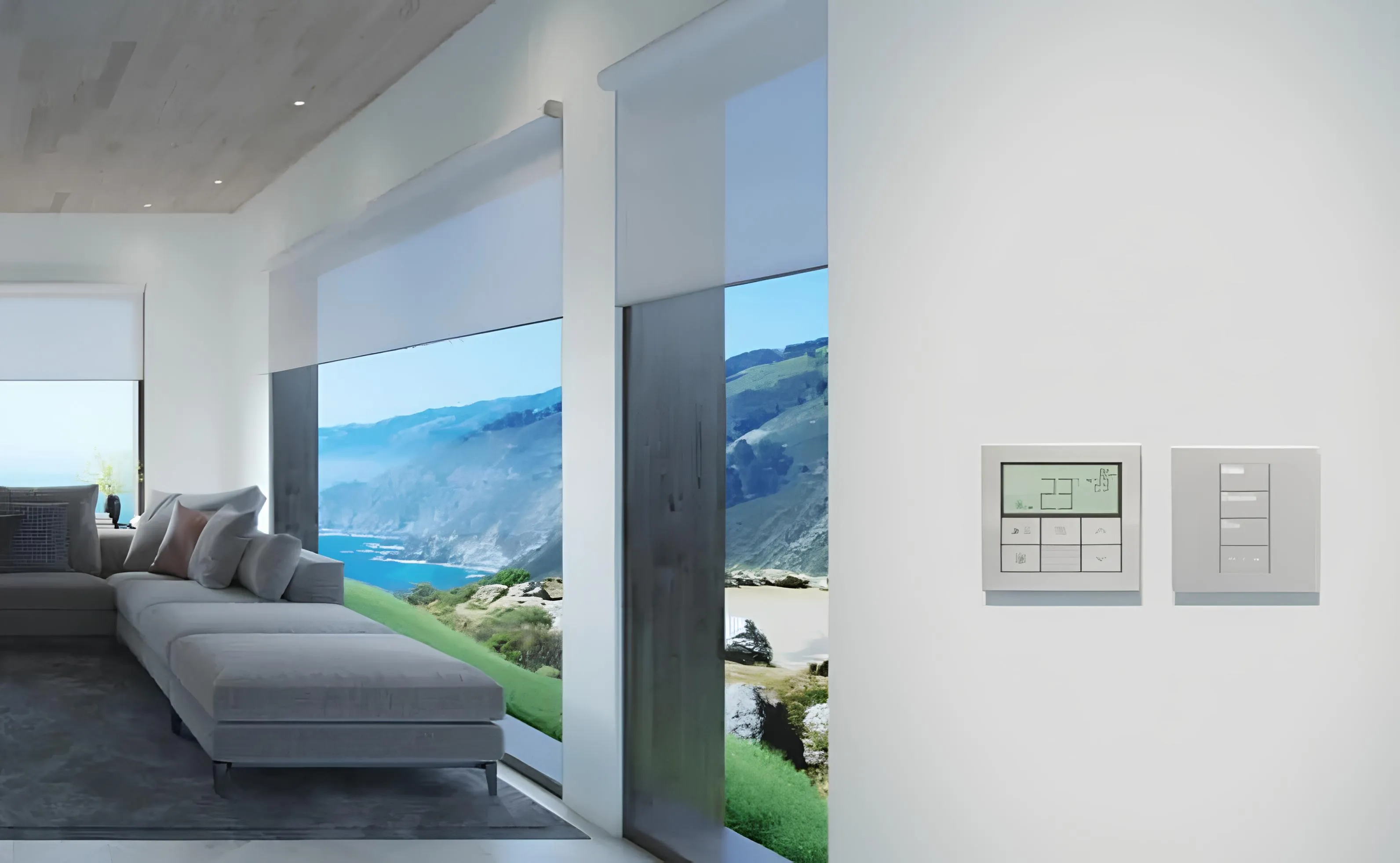 Modern living room with motorized roller shades and ocean view.