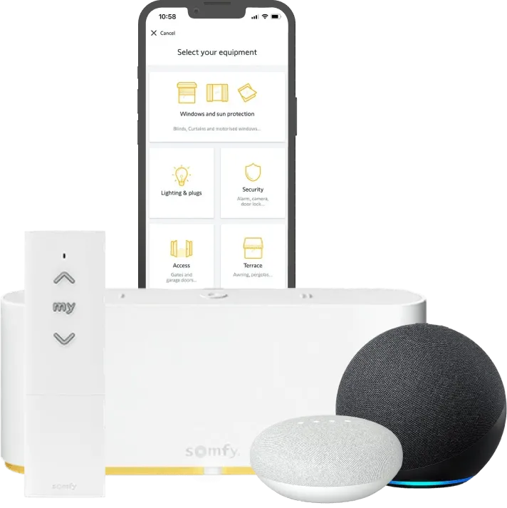 Smartphone displaying an app, with a remote control, a smart speaker, and a small hub device.