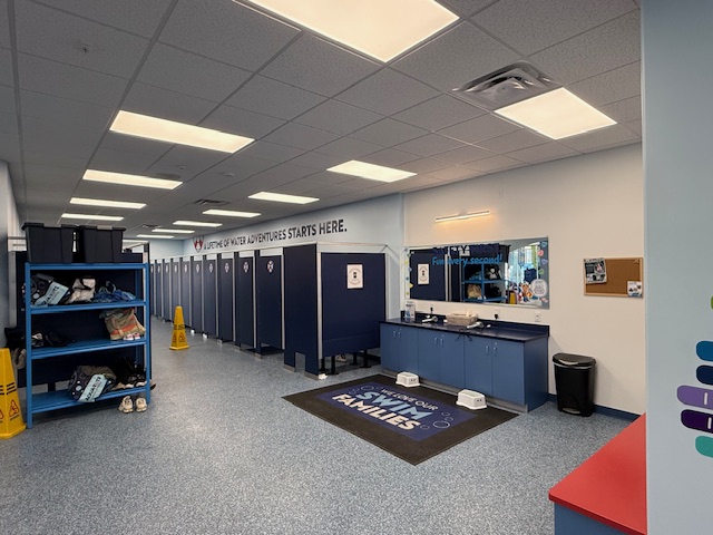Locker and sink area inside Aqua-Tots Amherst after patch and paint touch-up work.
