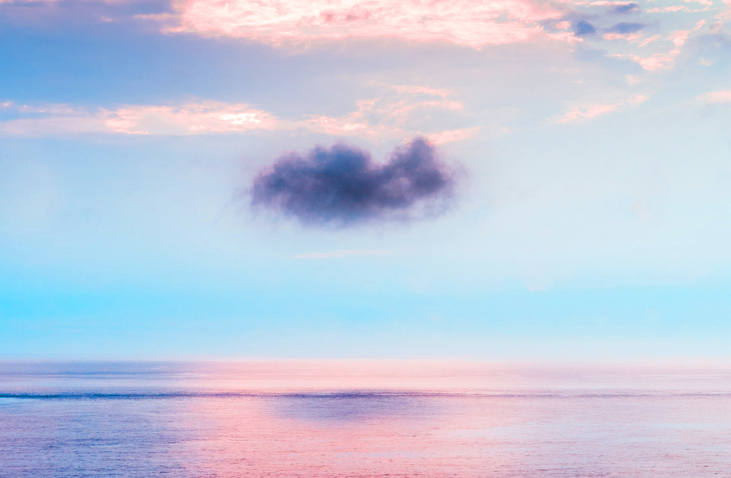 pink and light blue sky over the ocean