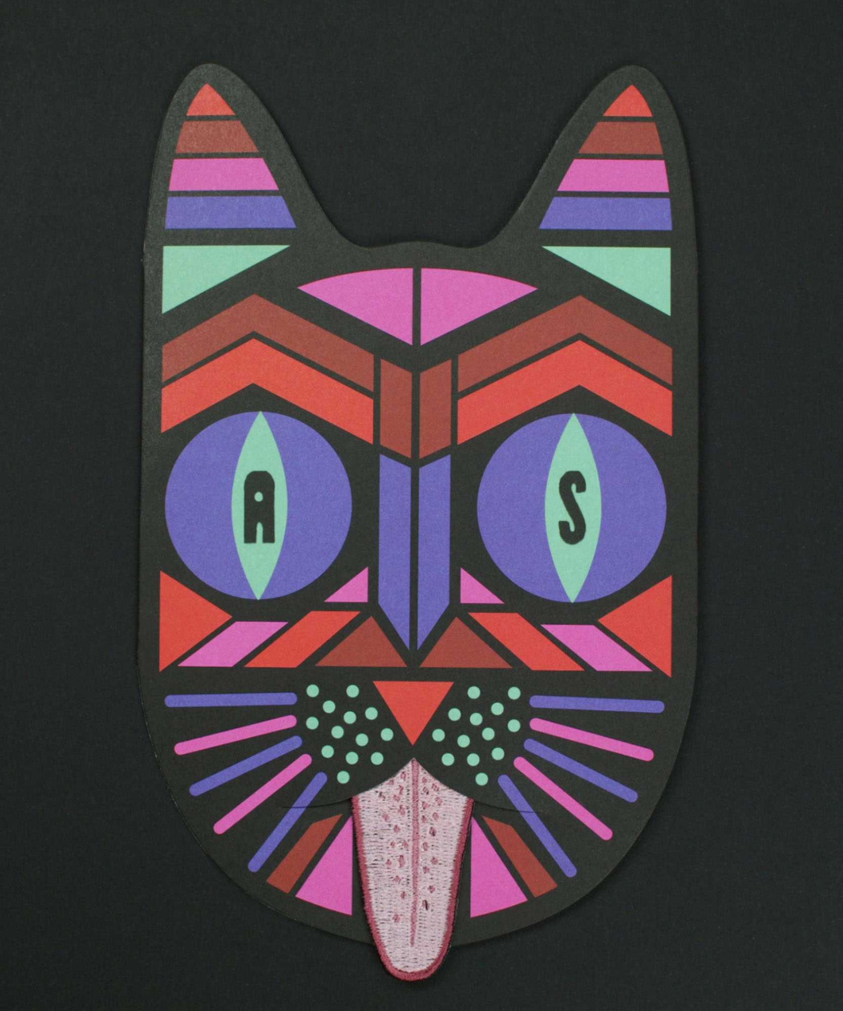 a card with a multi colored cat with a long tongue 