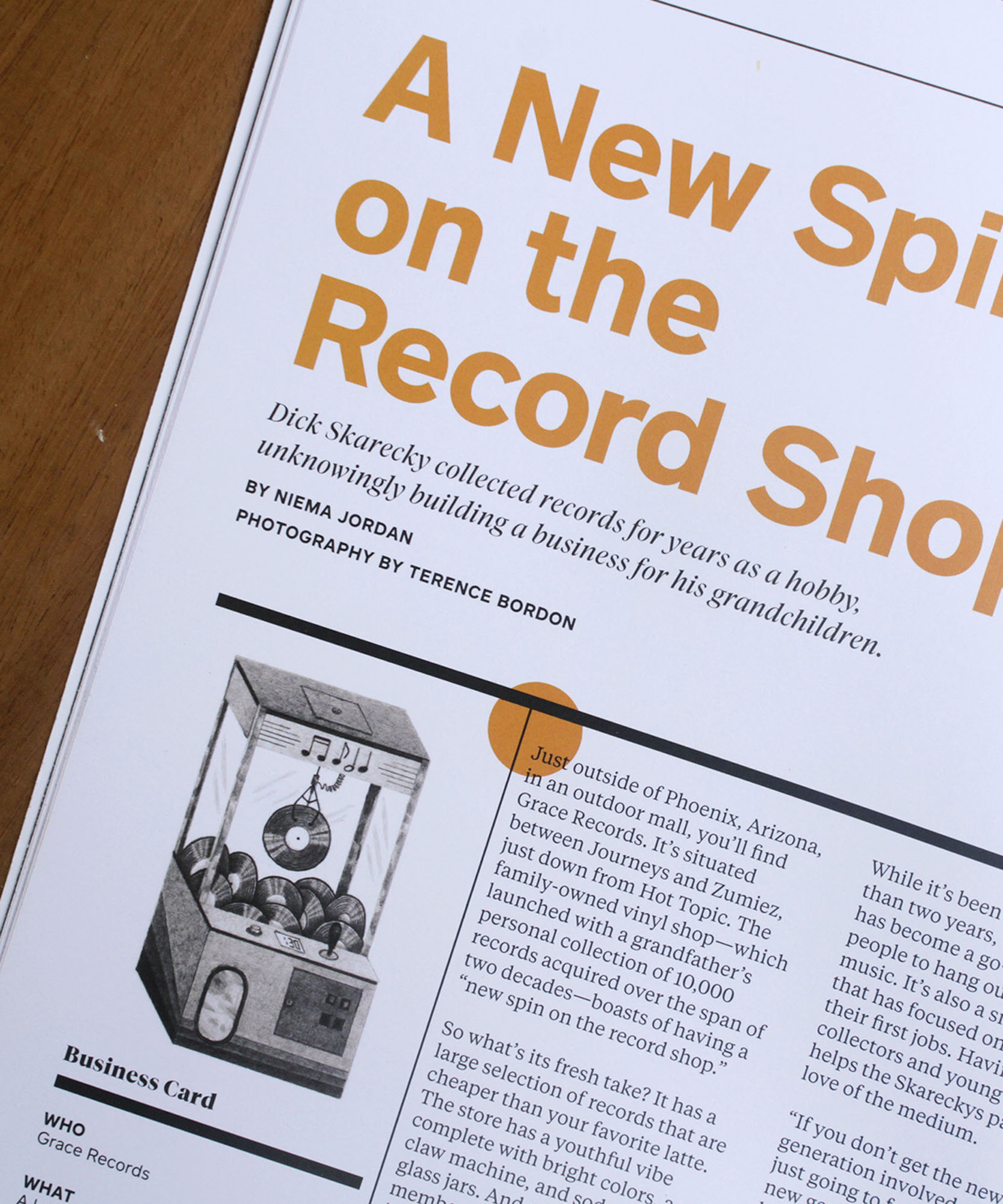 a photo of the inside of a magazine with an illustration in the bottom corner 