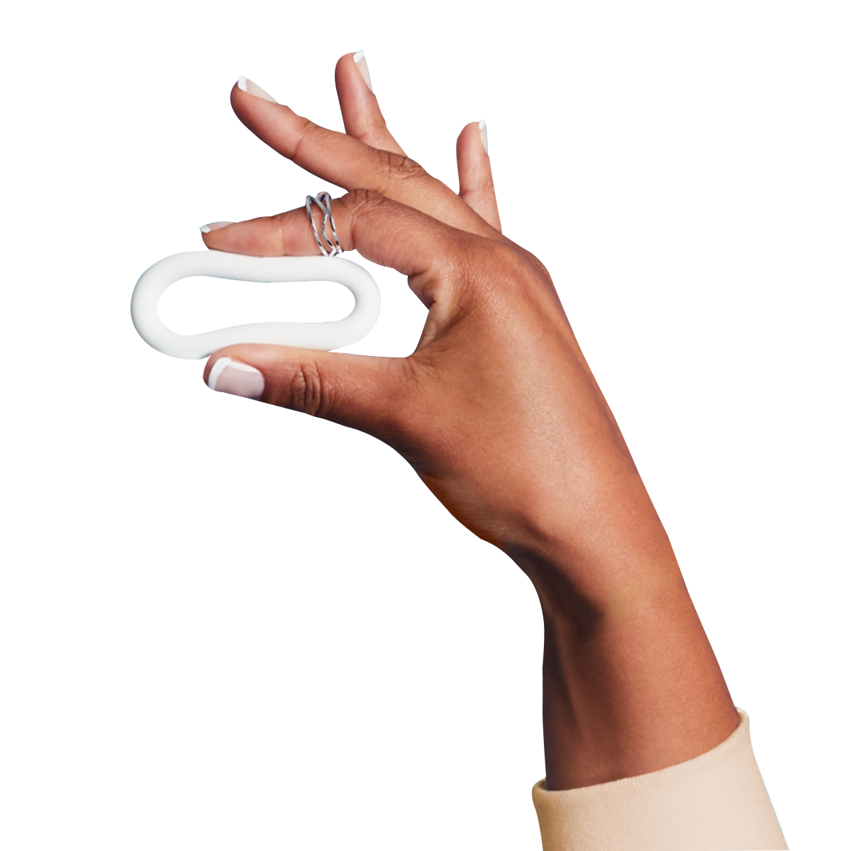 Hand holding a birth control ring