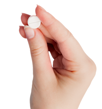 Hand holding an oral minoxidil pill
