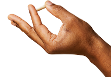 Hand holding a spironolactone capsule