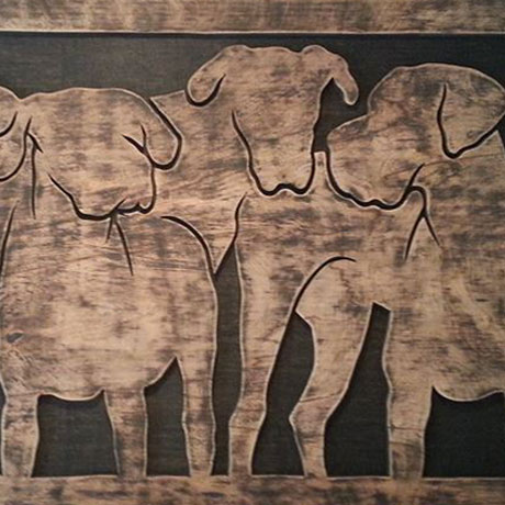 Silhouettes of four Great Danes on distressed Oak.
