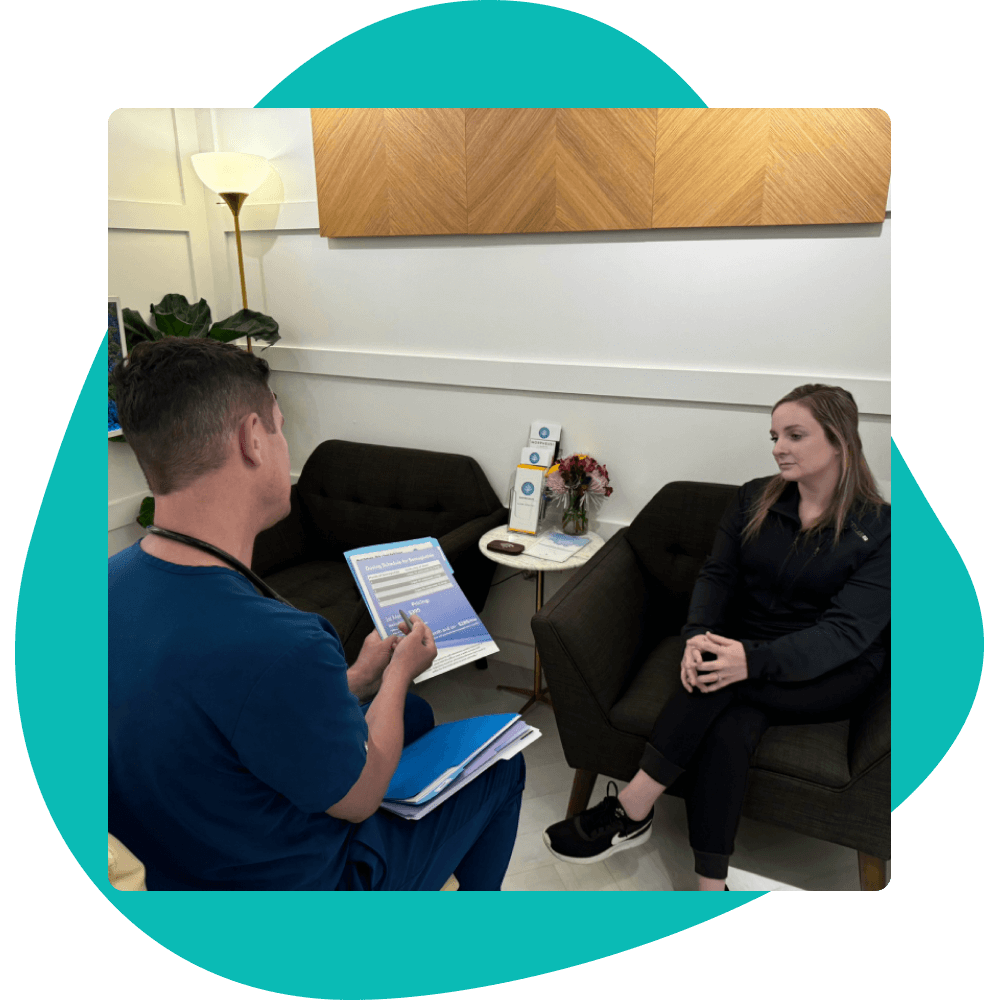 Doctor consulting patient in an office.