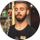 picture of a male bartender making a cocktail