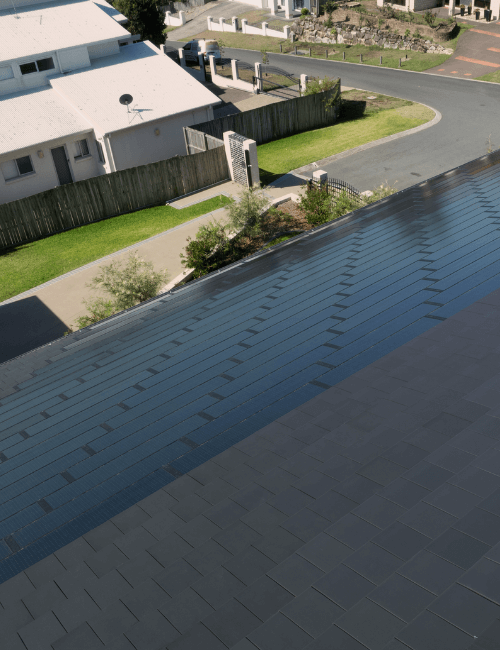Home reroofed with Volt solar tiles alongside Bristile Roofing tiles, creating a concealed solar roof