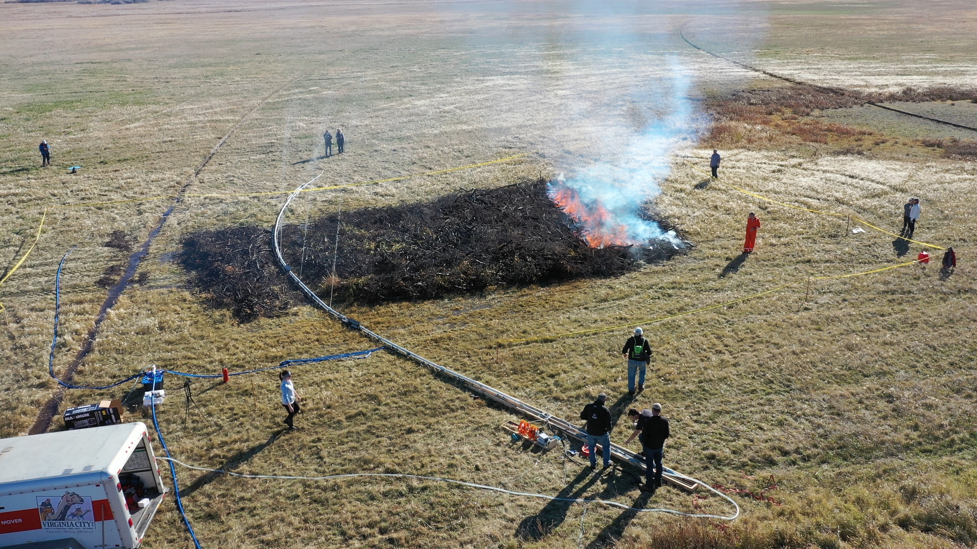 Wildfire Robotics' Firewall Robot spraying a prescribed burn in a prairie field.