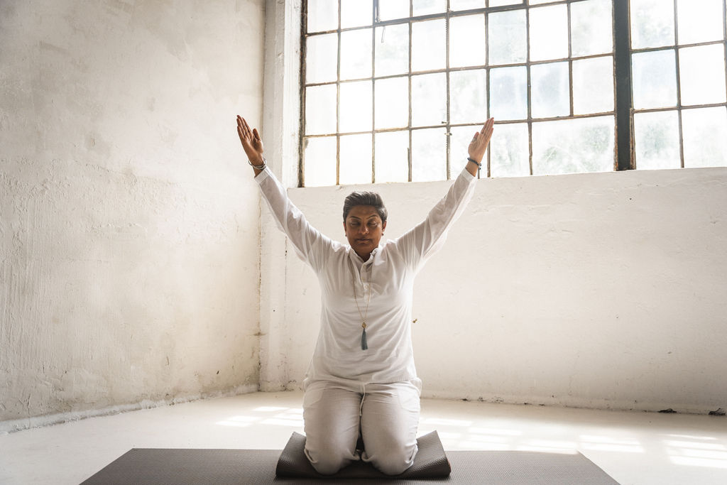Woman seated in stillness, nervous system healing