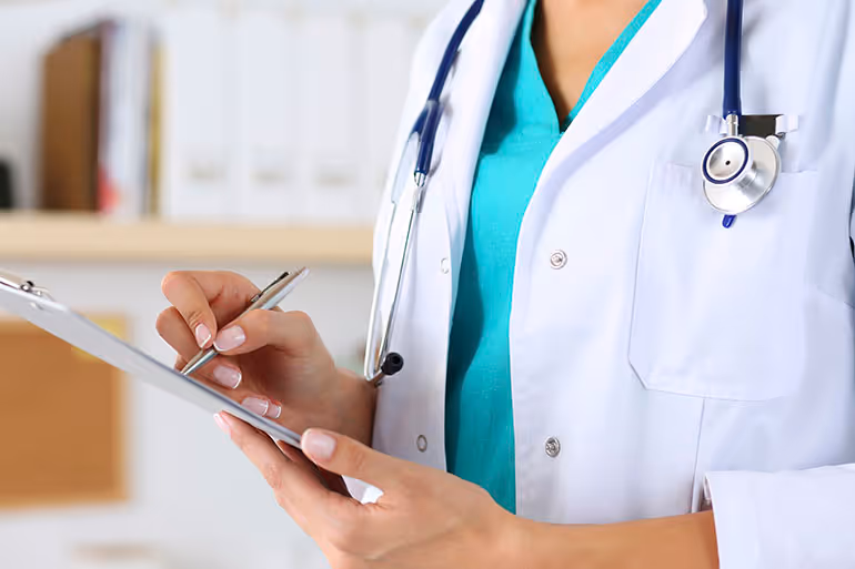 doctor writing prescription 