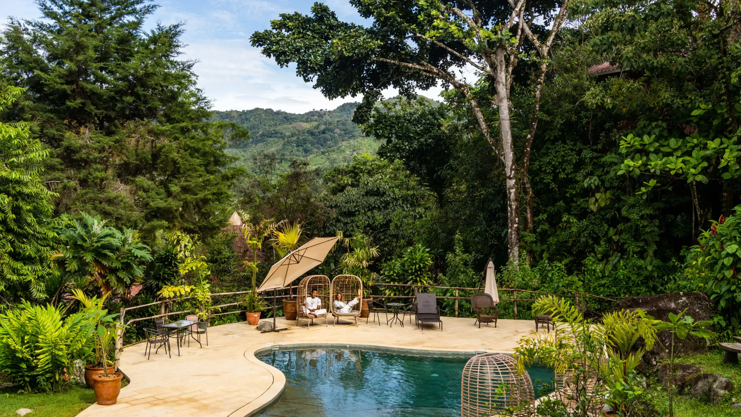 Mushroomtao founders chi leti relaxing by the pool in the jungle