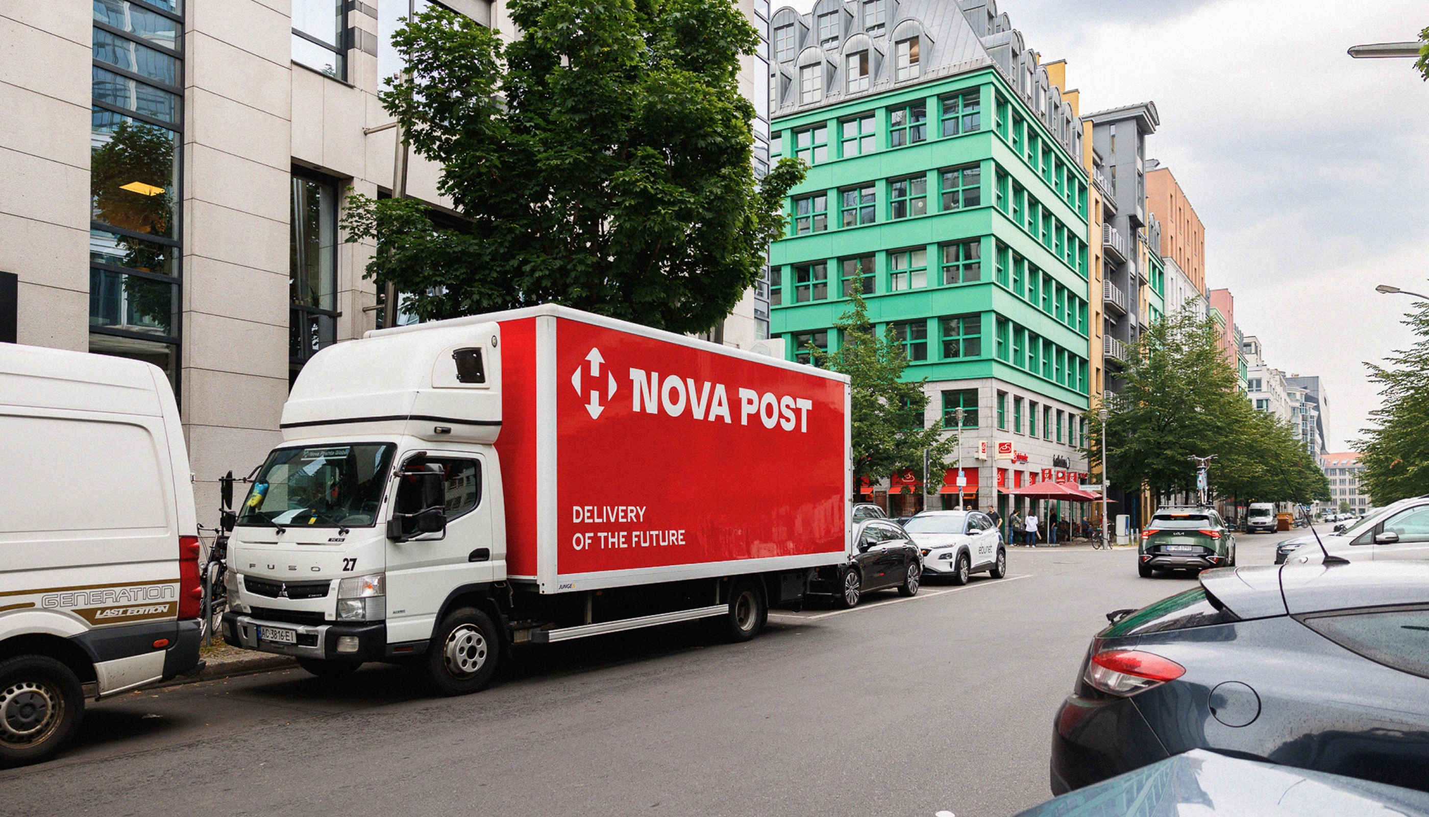 A side-view mockup of a white Nova Post delivery truck parked on a city street, showcasing logistics branding and vehicle wrap design. The truck features a bold red cargo box with the white Nova Post logo and the slogan "DELIVERY OF THE FUTURE" in modern sans-serif typography. The background shows a green European-style apartment building and urban greenery, highlighting the brand's presence in a real-world city environment.