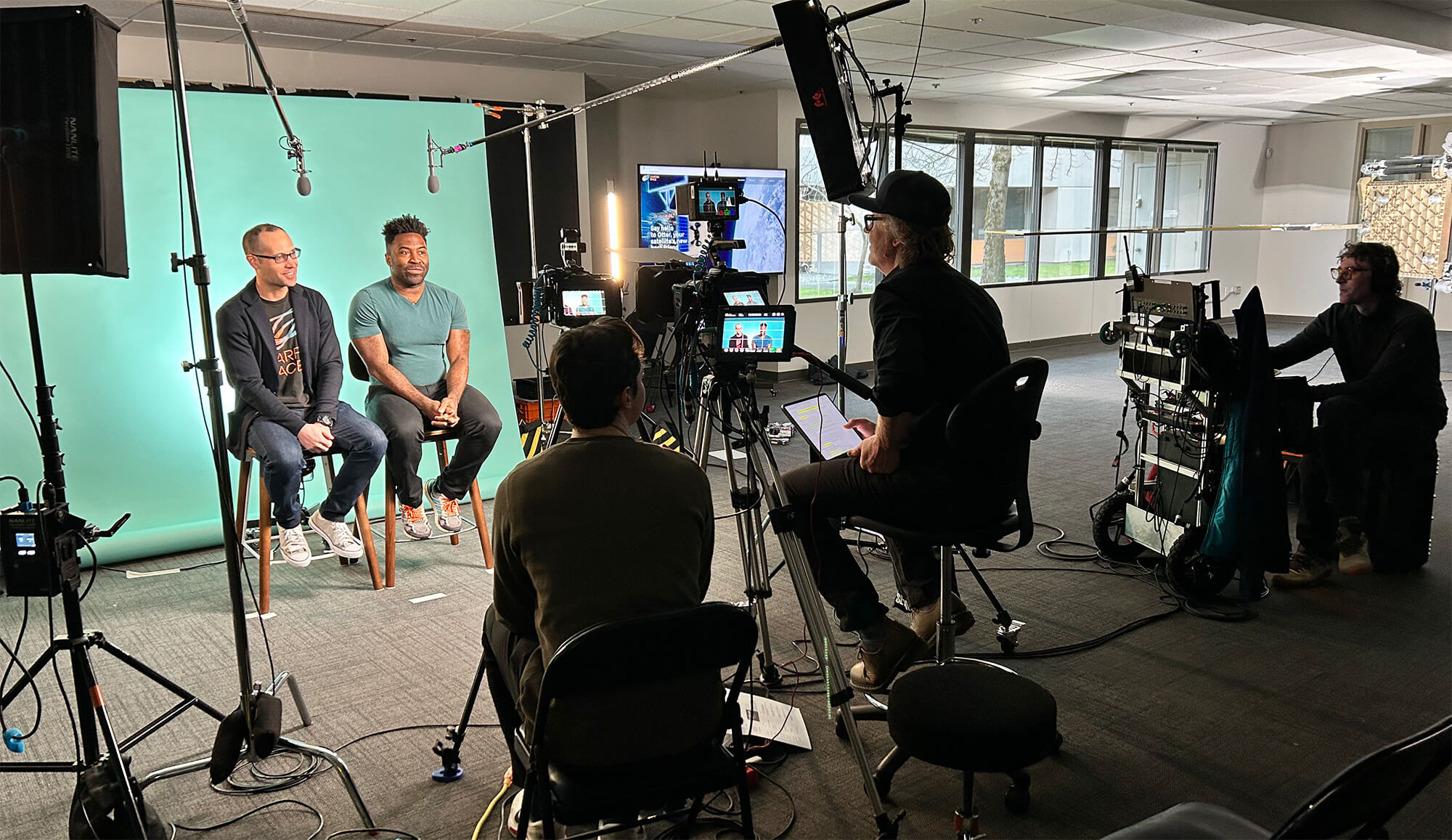 Crew filming an interview of Starfish Space employees