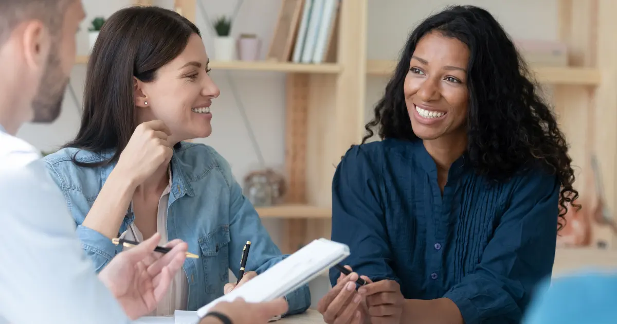HR leader meeting with a benefits broker to review employee benefits renewal options.