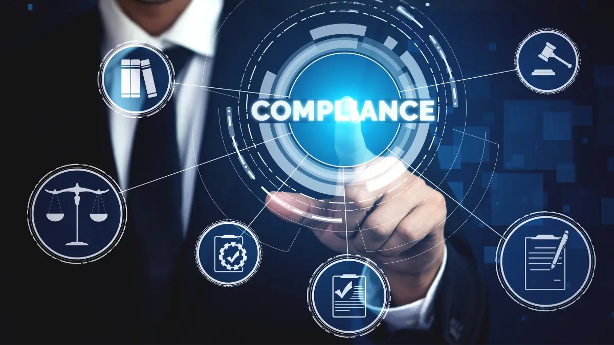 Businessman interacting with a digital compliance dashboard surrounded by legal and audit icons.
