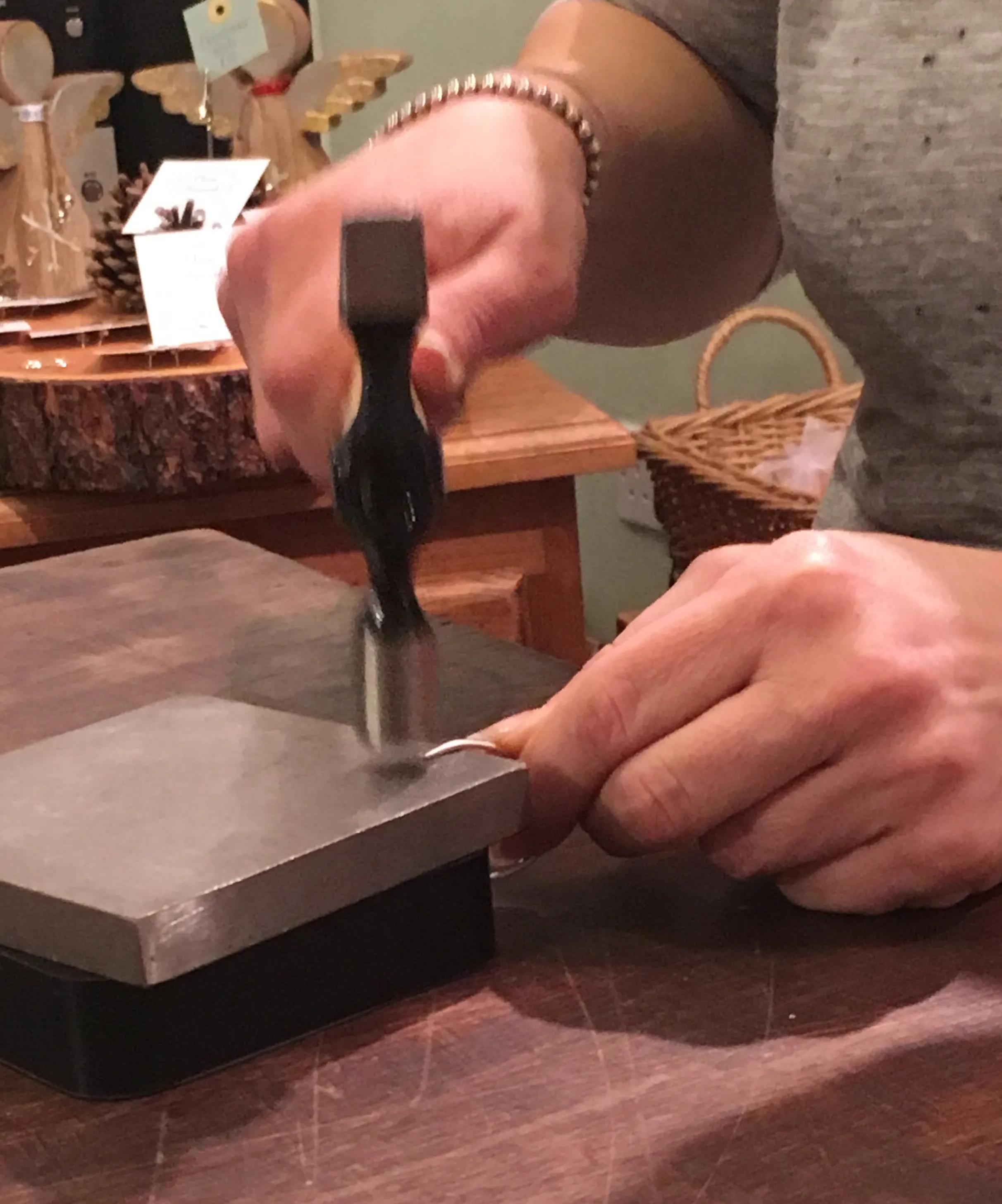 hammering whilst making pearl rings 