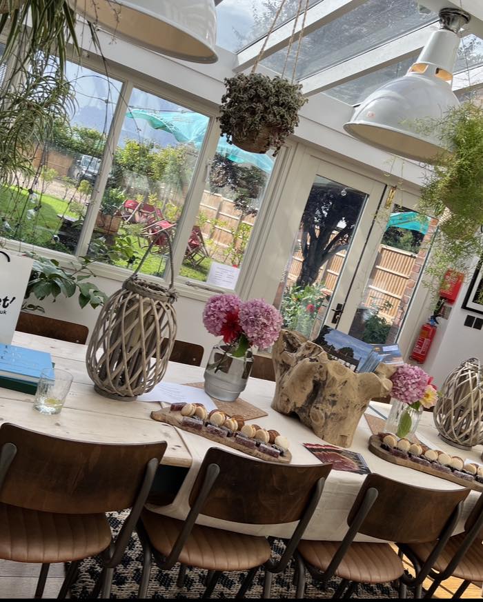 conservatory at Barack house Great massingham, table laid for meeting