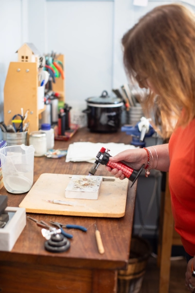 workshop photo with woman soldering