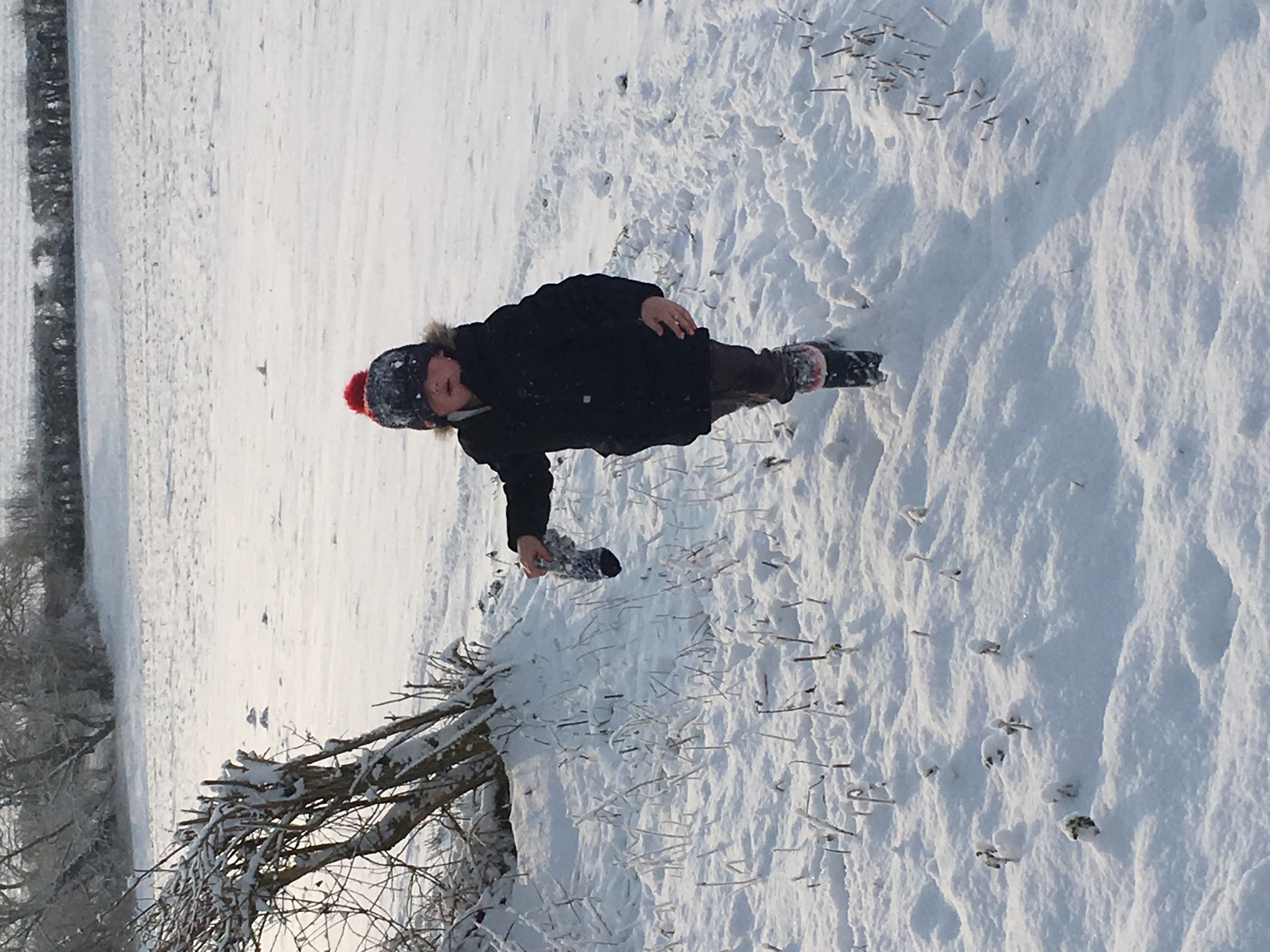 snowy day and small boy in winter clothes