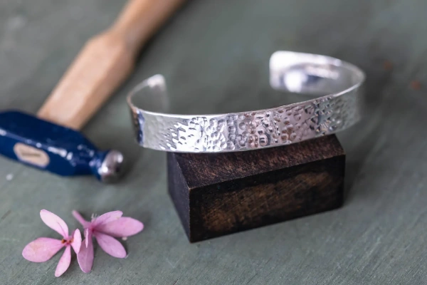 Handmade sterling silver wraparound cuff with hammered texture—adjustable, elegant, and full of quiet sparkle. A beautiful everyday or gift-worthy piece.
