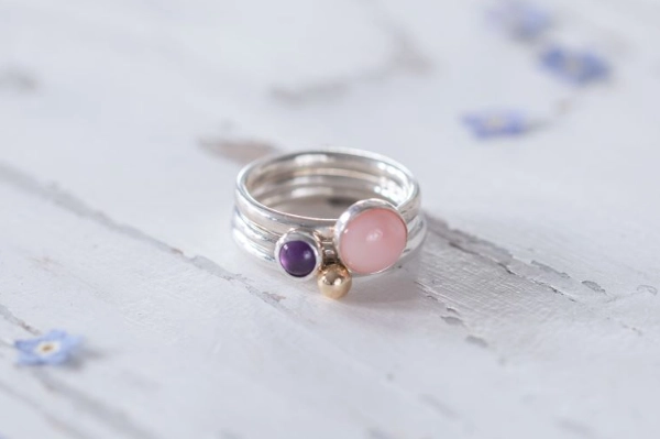 A handmade silver ring set inspired by Norfolk’s Marsh Orchids, featuring Pink Opal, Amethyst & gold—a gentle tribute to peace, nature, and surprise.