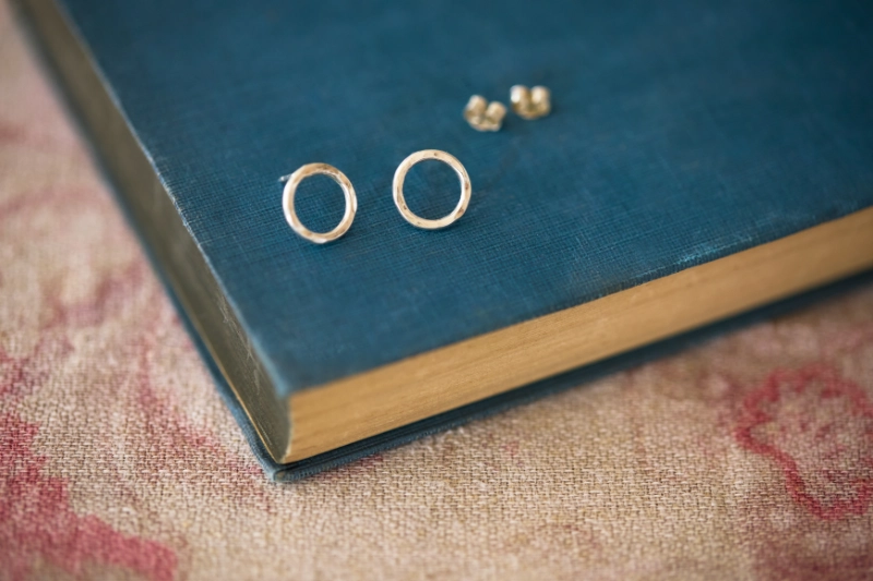 Handmade sterling silver hammered hoop stud earrings with a delicate textured finish. Simple little silver circles for easy everyday wear.