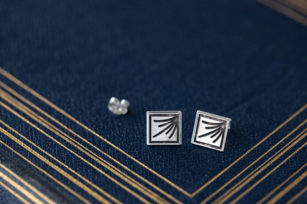 Sterling silver Art Deco earrings with engraved sunrise rays — a rectangular pendant inspired by dawn, hope, and the calm strength of daybreak.