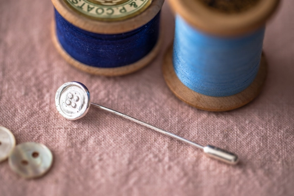 Handmade sterling silver button pin cast from a vintage find—nostalgic, delicate, and perfect for everyday wear or a sentimental gift.