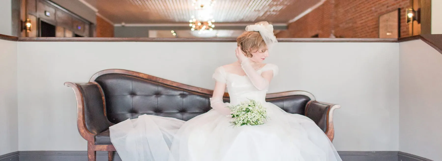 bride sitting on old school sofa