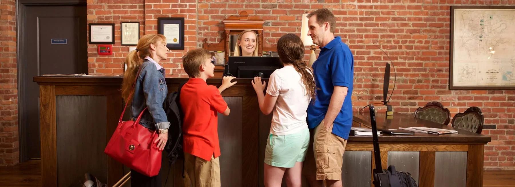 photo of family in front desk