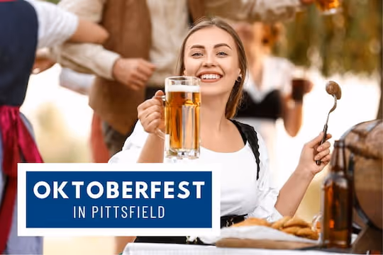 Oktoberfest in Pittsfield - Woman drinking beer and eating sausage